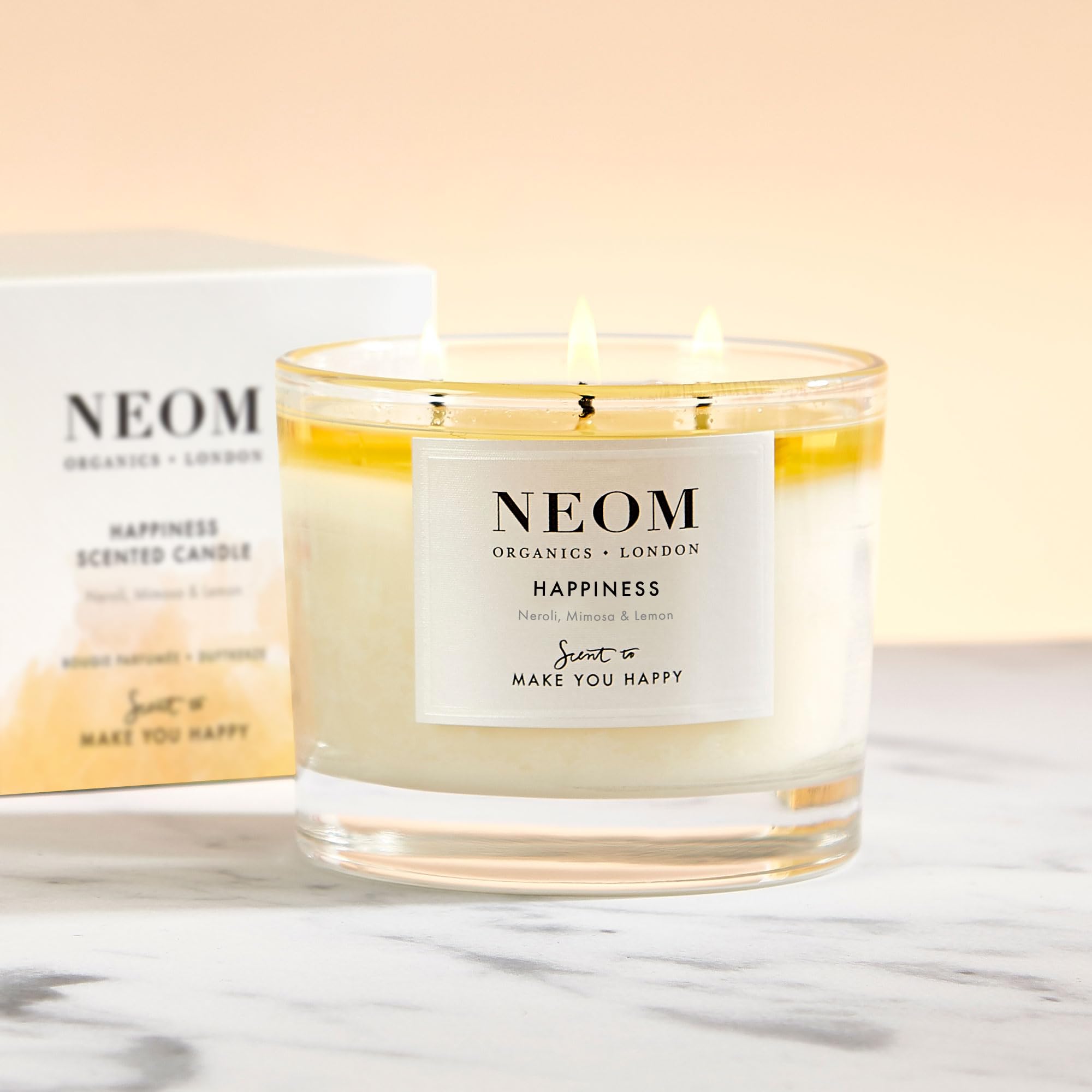 Neom Happiness neroli mimosa citron — parfum frais stimulant l'humeur.