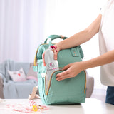 Ninja Mama Peri Bouteille, étui imperméable inclus, transport pratique.