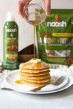 NOOSH yaourt végétal avec poudre d'amande non aromatisée, texture crémeuse et goût neutre.