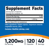 Nutricost Chitosan – capsules près d'un verre, utilisation quotidienne pratique.