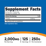 Cuillère-mesure Nutricost L-Proline, dosage précis pour chaque portion.