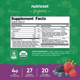 Verre d eau avec Nutricost Super Greens stickpack pour une préparation facile