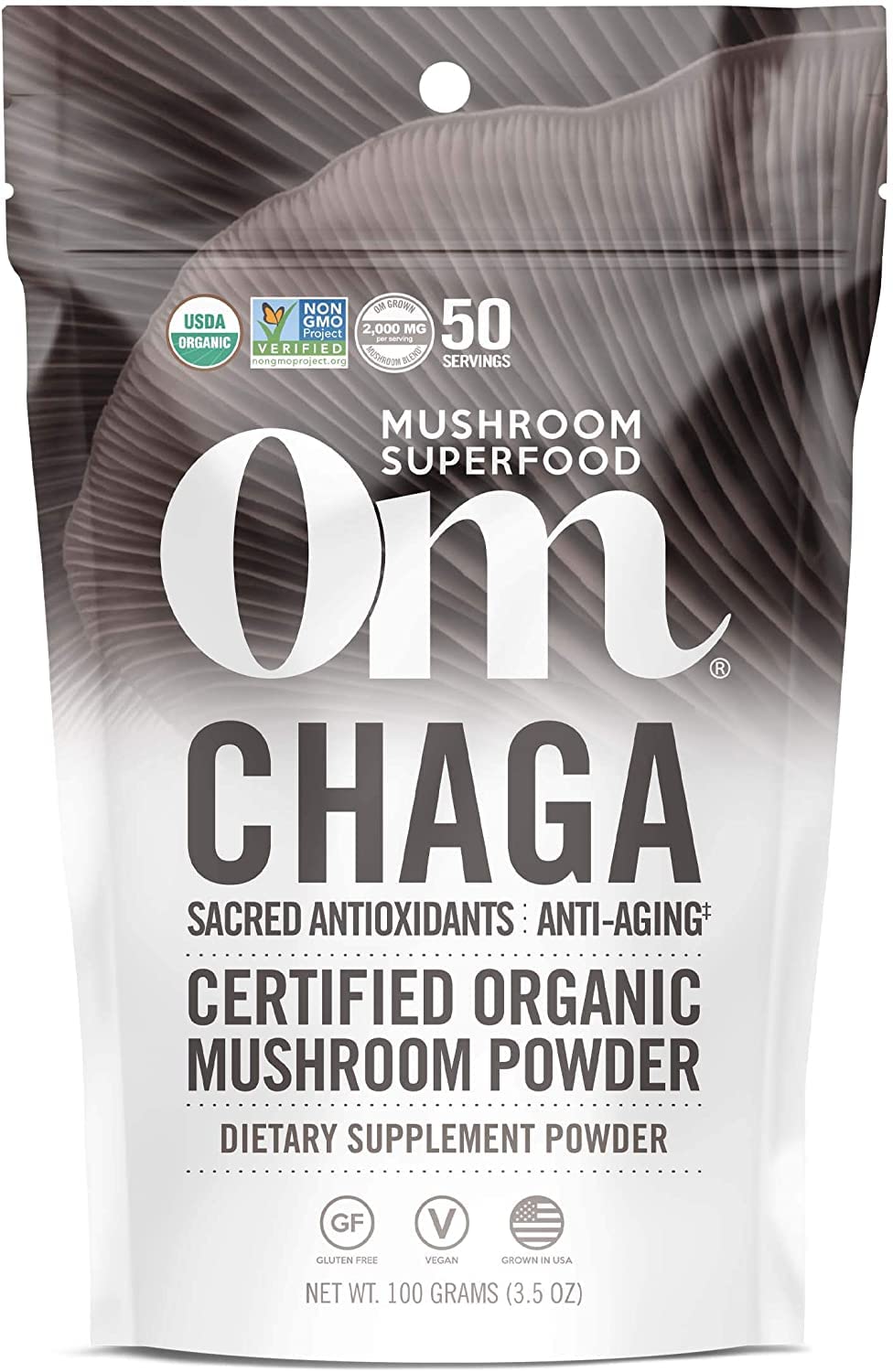 Om Mushroom Superfood Chaga en poudre dans un bocal pour un apport antioxydant naturel