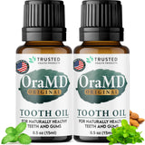 OraMD huile dentaire 4-en-1 en bouteille, routine naturelle d'hygiène buccale.