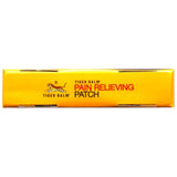 Pansement Tiger Balm sur le coude pour mobilité retrouvée.