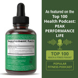 Verre d’eau avec gouttes Peak Performance.