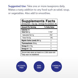 Gouttes d'huile noire de nigelle Physician's Strength prêtes à être mesurées.