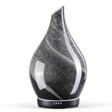 Porseme diffuseur en verre obsidien avec couvercle étoilé, ambiance relaxante.