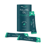 Primal Life Organics Real White Pulling Oil – démonstration de l’application et de la texture huileuse.