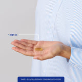 Prise quotidienne des capsules Pure Encapsulations pour routine Oméga-3.