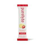 Verre avec Purelyte Fraise Citronnade, boisson rafraîchissante et sans sucre.