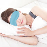 Masque QIHOMPIB bleu avec pont nasal bloquant la lumière efficacement.