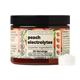 Santa Cruz Paleo Electrolyte Powder arôme pêche dans un verre d'eau pour une hydratation rafraîchissante.