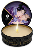 Bougie Shunga Massage Fruits Exotiques libérant une huile tiède pour un massage sensoriel.