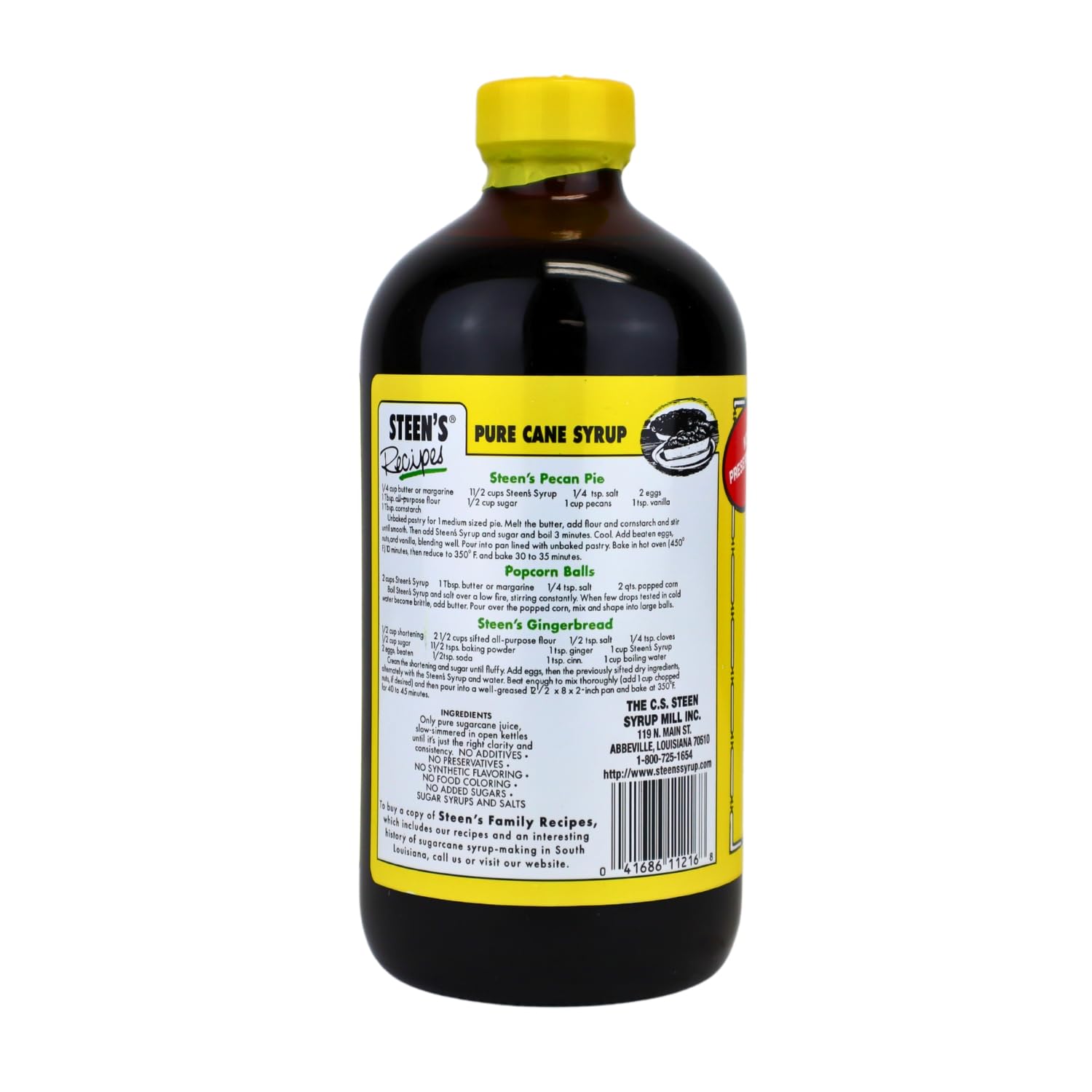 Steen's sirop de cane pur – versement dans un verre, texture lisse