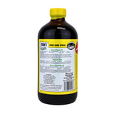 Steen's sirop de cane pur – versement dans un verre, texture lisse