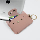 Étui STERCULIA pour pilules en PU cuir rose clair, ouverture montrant le rangement.