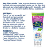 Enfant utilisant Tanner's Tasty Paste Baby Bling sans fluorure, expérience de brossage douce.