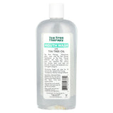 Tea Tree Therapy bain de bouche sans alcool, etiquette claire et design moderne pour la salle de bains.