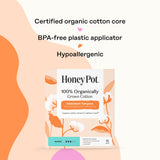 Main utilisant l applicateur The Honey Pot en grip pour insertion sûre.
