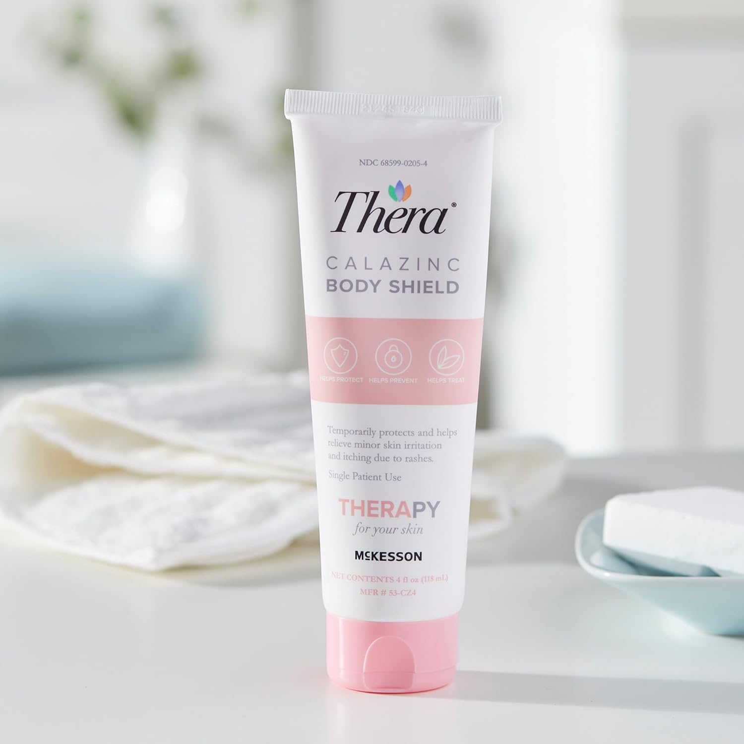 Thera Calazinc Body Shield, utilisation en déplacement pour soin rapide.