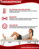Thermophore Classic en utilisation sur le dos pour détendre les muscles.