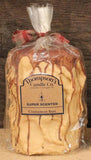 Thompson's Candle Co Cinnamon Bun 44oz pilier, vue du dessus, ambiance cosy prête à envelopper la pièce.