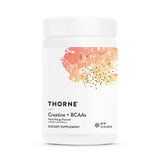 THORNE Creatine + BCAAs Peach Mango - flacon, poudre micronisée pour énergie et récupération.