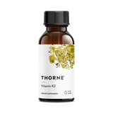 THORNE Vitamine K2 Liquid: bouteille avec pipette pour dosage précis.