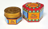 Tiger Balm Red Pommade en application, massage zone douloureuse.