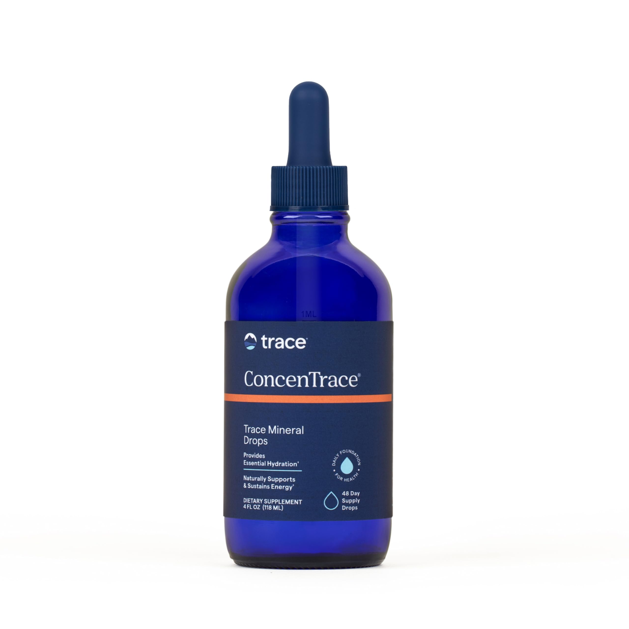 Trace Minerals ConcenTrace gouttes dans un verre d'eau pour une hydratation optimale.