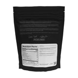 Gobelet doseur True Nutrition avec protéine de pois isolat prête à être mélangée