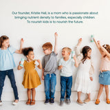 Enfant souriant après avoir pris les gommes True Littles.