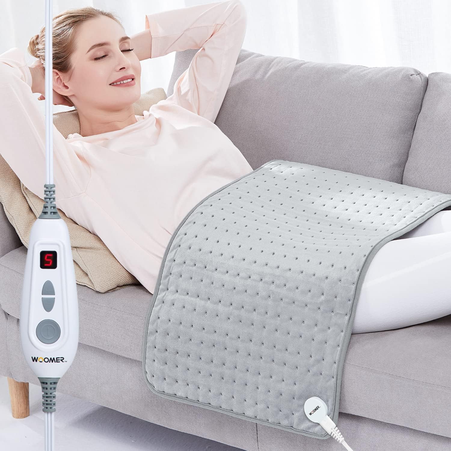 WOOMER bouillotte thermique XXL enveloppant le dos et les épaules pour une chaleur ciblée.