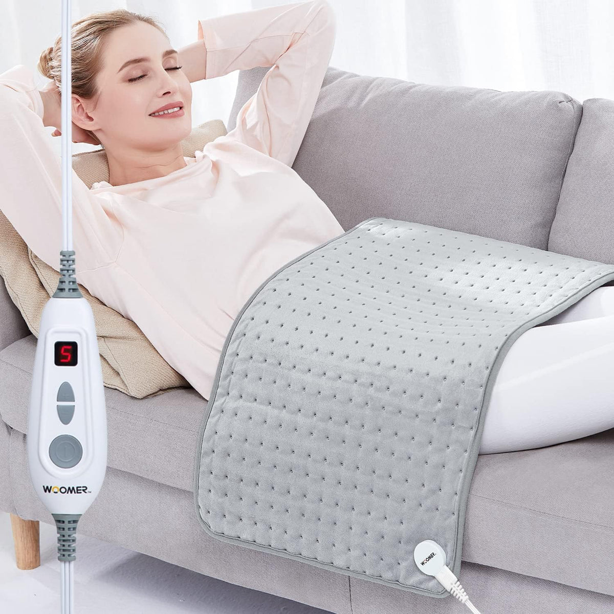 WOOMER bouillotte thermique XXL enveloppant le dos et les épaules pour une chaleur ciblée.