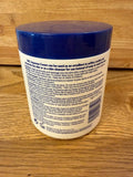 XBC Crème émolliente aqueuse appliquée sur peau, texture légère et hydratante.