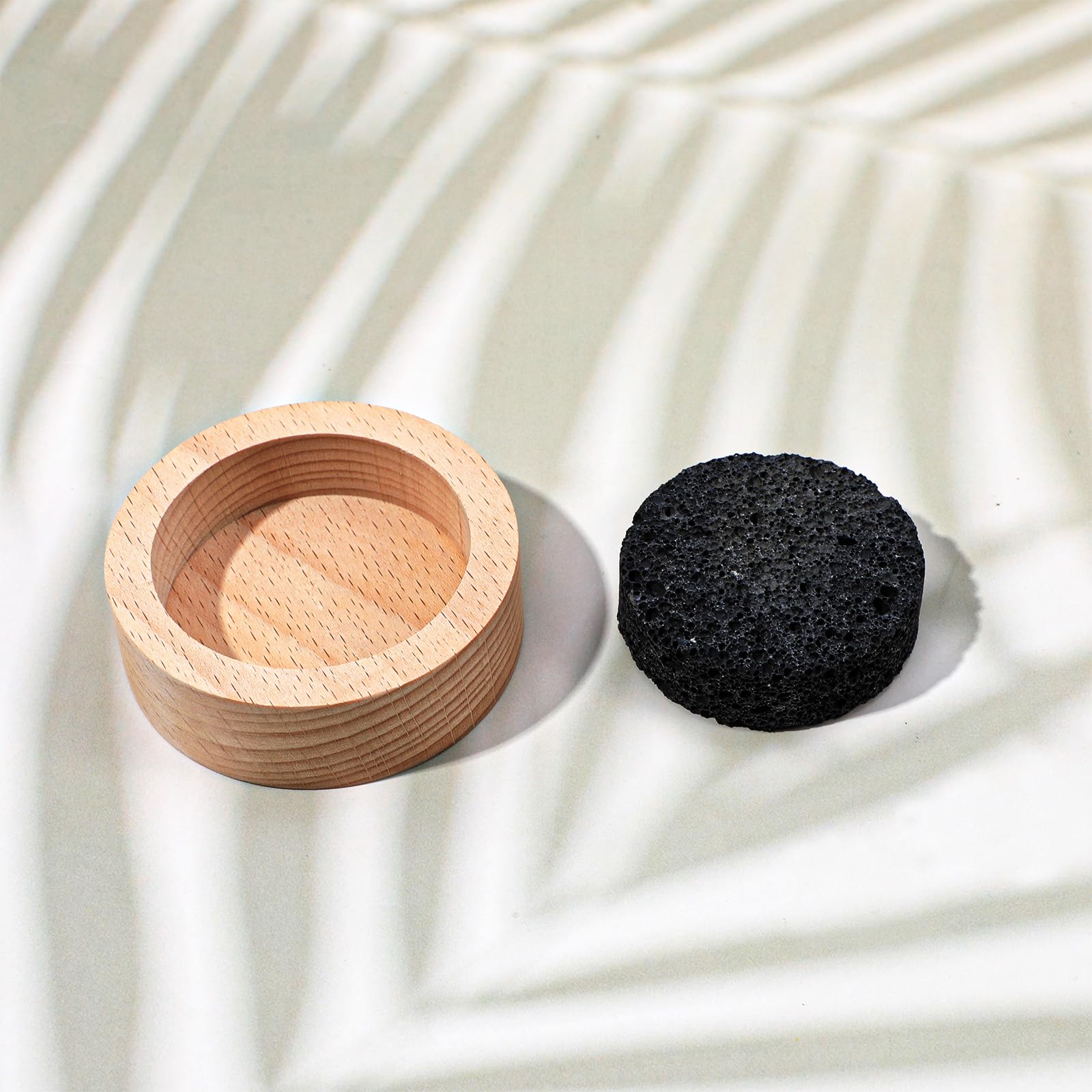 Gros plan sur les pierres poreuses du diffuseur XLIUAX pour absorption des huiles.