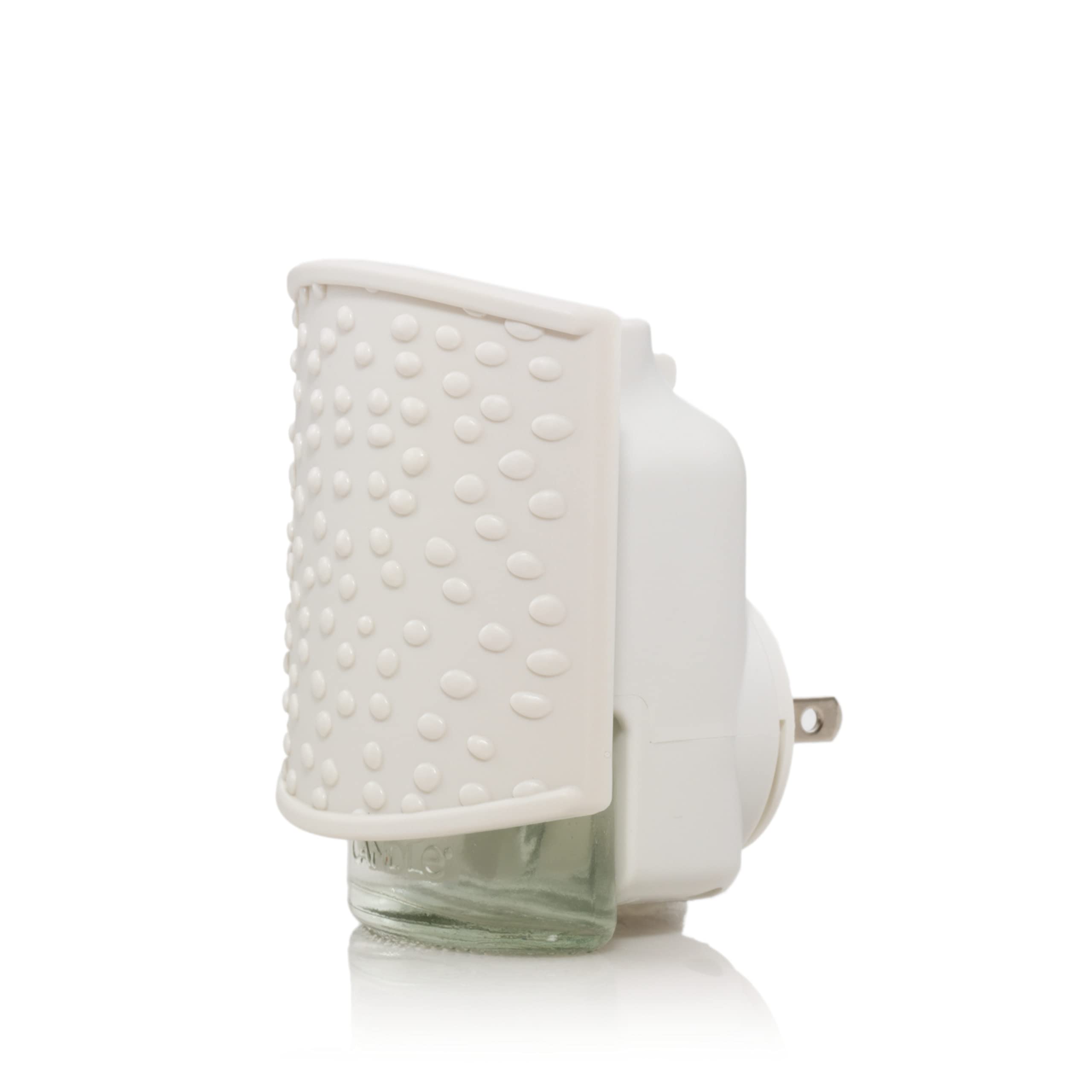 Intérieur avec le diffuseur Yankee Candle Sprinkle Dots ScentPlug visible et élégant.