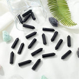Baguettes hexagonales d'obsidienne noire YATOJUZI en premier plan.