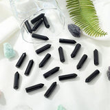 YATOJUZI gros-plan-pierre-obsidienne-noire-polies montre texture et brillance naturelle.
