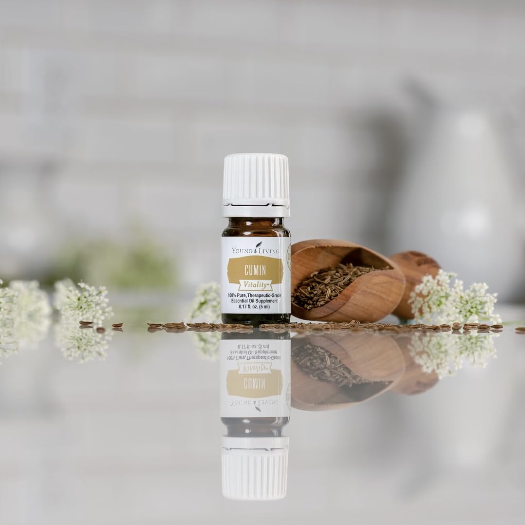 Goutte d'huile Young Living Cumin Vitality — pipette pratique pour doser en cuisine.