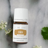 Plante de cumin et flacon Young Living Vitality — rappel des ingrédients naturels.