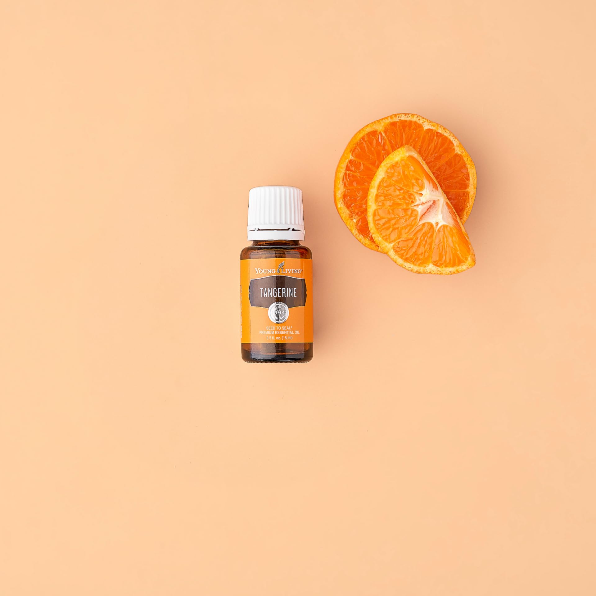 Young Living Tangerine diffusion aromatherapie crée une atmosphère lumineuse et positive.
