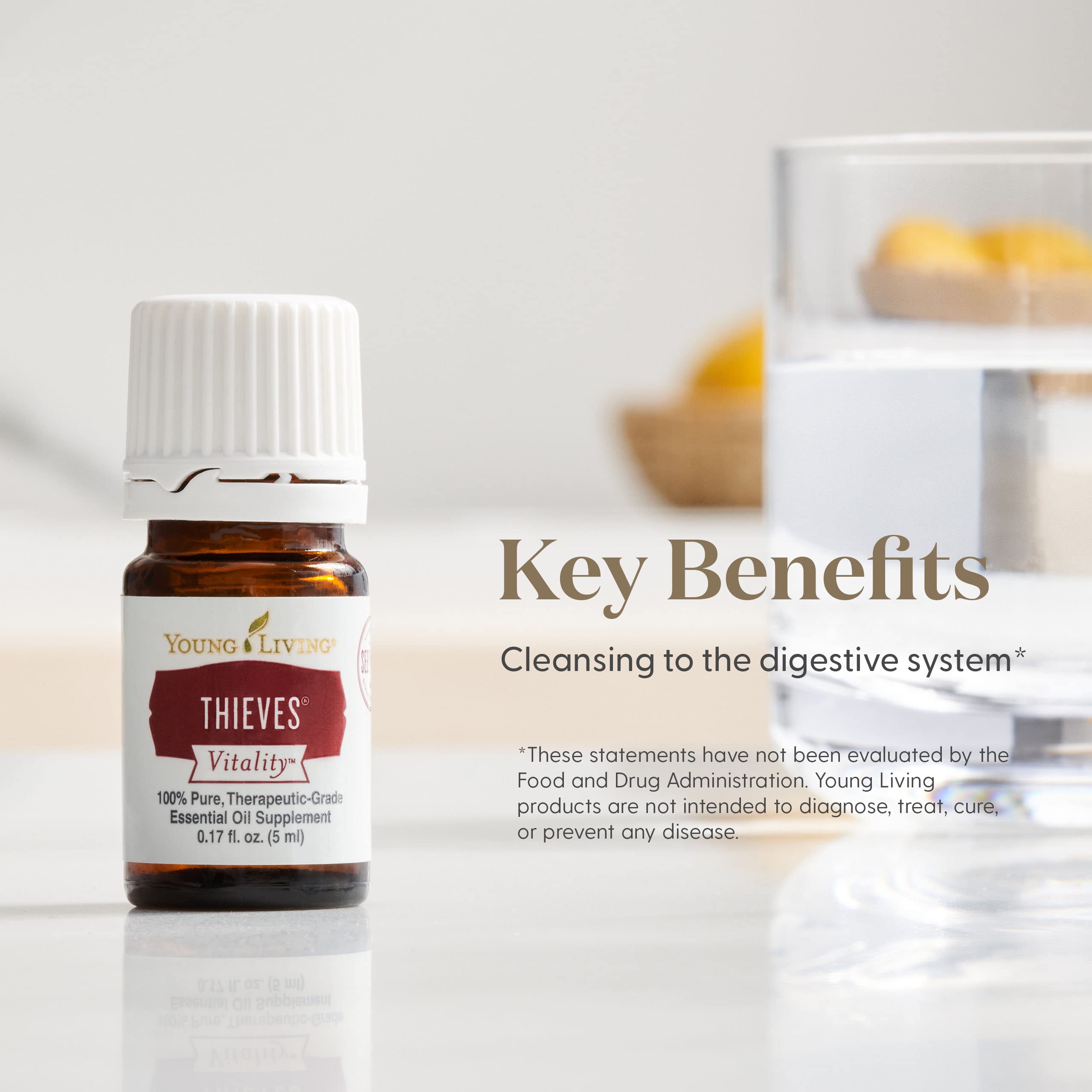 Young Living Thieves Vitality, huile essentielle pure, parfaite pour un massage relaxant.