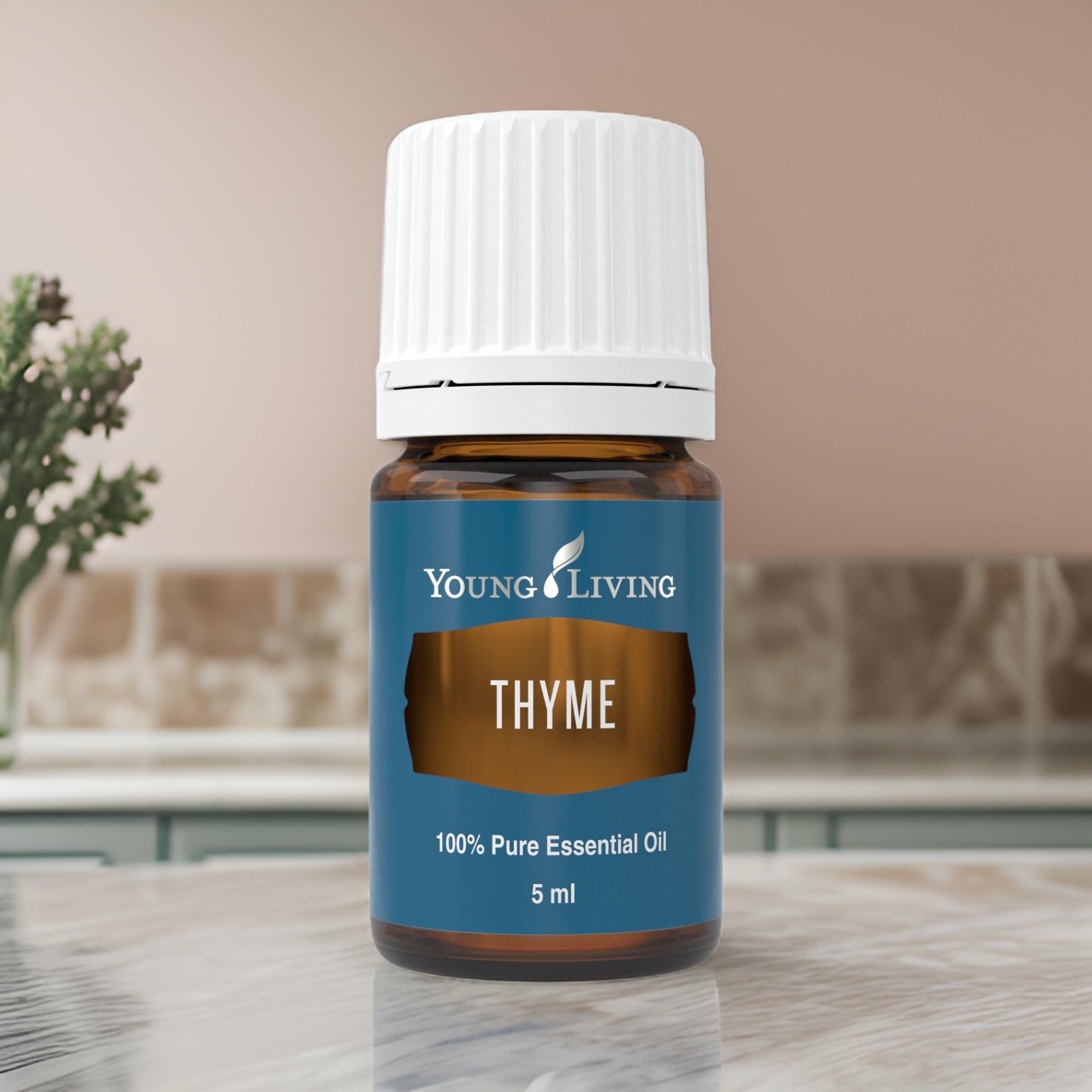 Young Living Thym huile essentielle, massage, arôme frais pour une expérience relaxante.