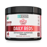 Poudre rouge biologique Zhou dans une bouteille-doseur pour un apport antioxydant quotidien.